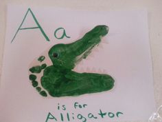 a green alligator handprint with the letter a is for alligator