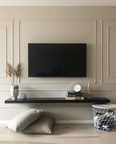 a flat screen tv mounted to the side of a wall