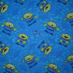 a blue background with cartoon characters on it and a ring in the middle that is surrounded by smaller green monsters