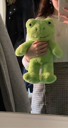 a green spring frog from build-a-bear being held by a girl with brown hair, in front of a mirror Toy Pictures, Frog Pictures, Frog And Toad, Cute Stuffed Animals, Cute Frogs, Fleetwood Mac, Cute Plush