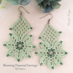 the earrings are made with green beads and crochet