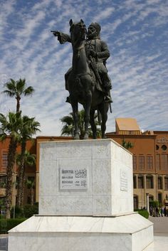 a statue of a man riding on the back of a horse