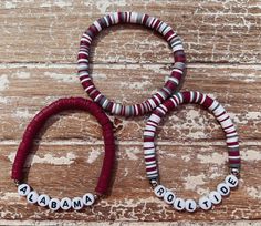 "Perfect for those Alabama Crimson Tide games or just for the fans!  These bracelets are 100% handmade with stretch cord to go over your hand. Overstretching may cause breakage. I use 14k Gold plated, Sterling Silver plated and Stainless-Steel beads that should not tarnish if taken care of. That means avoiding water, lotions, sweating, sanitizer, etc. Set of 3 Sizing: If you are unsure of what size you would like take a sewing measuring tape or a piece of string. Wrap around your wrist and then Adjustable Stacked Heishi Beads Stretch Bracelet, Fan Bracelet, Etsy Bracelets, Beaded Bracelet Stack, Football Jewelry, Boho Bracelets Stack, Team Bracelets, Stacked Beaded Bracelets, Football Bracelet