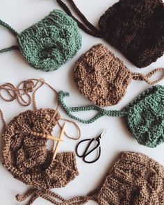 several crocheted items are laid out on the table