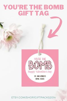 a pink gift tag with the words, you're the bomb happy valentine's day