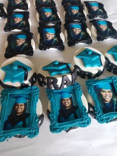 graduation cookies decorated with blue and white icing are arranged in the shape of frames