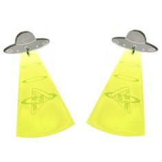 two yellow triangle shaped earrings with an alien design on the front and back of them