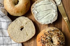 three bagels, one with cream cheese and the other with sprinkles