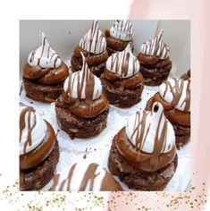 chocolate desserts with white frosting and drizzled on top are displayed