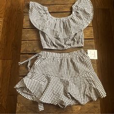 Meet Me In Santorini Set. Perfect Condition. Skort Is New With Tags. Off Shoulder Ruffle Top Is New With Out Tags. Never Worn Or Washed. Skirt Is A Medium And Top Is A Small. I Sized Up In The Skirt. Though It Is Very Stretchy And Versatile. Elastic Waist On Top And Skort. Wrap Around Can Be Wrapped Right At Waist Or Looser For Asymmetrical Look. Can Be Cropped Top Or Pulled Down. I Think Top And Bottom Are Both Fine For Most Smalls And Mediums. The Color Was Sold As Black. It Does Look Black Bu Casual White Sets For Brunch, White Chic Mini Sets, Chic White Mini Length Sets, Fitted Gingham Sets For Spring, Fitted Casual Sets For Brunch, Long Sleeve Tshirt Dress, Burgundy Sweater Dress, Long Sleeve Fitted Dress, Tory Burch Dress