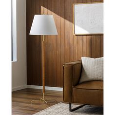 a living room scene with focus on the floor lamp