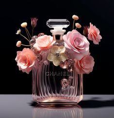 a chanel perfume bottle with pink flowers in it