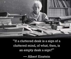 an old woman sitting at a desk with books