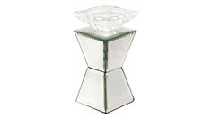 a clear glass vase with a diamond shaped centerpiece on it's stand, against a white background