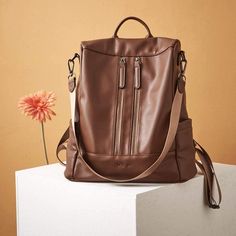 The Long Shoulder Strap Is Made Of Nylon. The Women Backpack Is Made Of Vegan Leather, Soft And Water Resistant. High-Grade Black Hardware, Dark Brown Interior Polyester U-Zip Opening That Includes Two Slip Pockets And One Zipper Pocket On The Back Of The Backpack Size: 13.78l X 14.96h X 6.3w Inches; Net Weight: 1.92 Lb (0.87 Kg) You Can Carry It In 2 Ways: Backpack Or Shoulder Bag Brown Leather Backpack With Zipper For Daily Use, Brown Leather Backpack With Zipper Pocket For School, Casual Brown Leather Backpack With Zipper, Brown Faux Leather Backpack For On-the-go, Brown Faux Leather Backpack With Zipper Closure, Brown Leather Backpack Large Capacity For On-the-go, Brown Leather Satchel Backpack With Zipper, Brown Leather Backpack With Large Capacity For On-the-go, Large Capacity Brown Leather Backpack For On-the-go