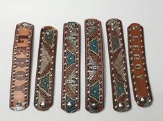 four different types of belt buckles on a white surface with the words rodeo printed on them