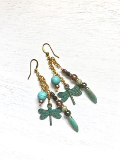 Dragon Fly Earring For Her, Handmade Dangle Dragon Fly for Women, Drop Bohemian Earring, One of a Kind Gift for Her. Handmade Dangle Dragon Fly earring, made with Czech glass beads, Bronze charm, turquoise, brass chain. Length is 2.25 inches Free shipping with USPS, packed and protected in a gift box. Artisan Adjustable Dangle Chandelier Earrings, Artisan Adjustable Chandelier Dangle Earrings, Bohemian Drop Earrings With Dangling Charms, Handmade Bronze Dangle Chandelier Earrings, Green Bohemian Earrings With Dangling Charms, Bohemian Green Earrings With Dangling Charms, Diy Boho Jewelry, Creative Earrings, Bead Creations