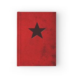 a red book with a black star on it