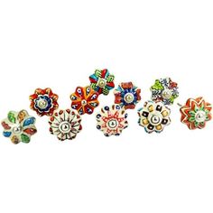 six colorful flower shaped beads on a white background