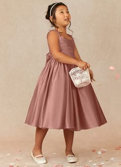 Let your flower girl have fun walking down the aisle while tossing petals in our Matte Satin A-line dress, Cutie Pie. Her square neckline is ruched beautifully and has elastic straps. The back ties into a beautiful bow while the gathered skrit is perfect for twirling an dancing. This dress is not only perfect for a flower girl at a wedding but also versatile enough for other special occasions. Rose Gold Flower Girl Dress, Old Rose Dress, Flower Maiden, Kids Bridesmaid Dress, Pink Toddler Dress, Blush Flower Girl Dresses, Ruffle Neck Dress, Fall Bridesmaid Dresses, Pink Flower Girl Dresses