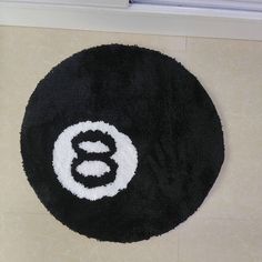 a black and white rug with the letter b on it