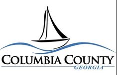 the columbia county logo with a sailboat in the water and blue waves behind it