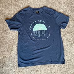 Very Nice Hurley Surf Co. T-Shirt New Without Tags. Never Worn, Only Washed. (The Square On The Top Of The Back Of The Shirt Is From The Tag) Soft-washed Blue T-shirt With Short Sleeves, Blue Soft-washed Short Sleeve T-shirt, Soft-washed Blue Short Sleeve T-shirt, Blue Summer Shirt With Logo Print, Soft-washed Blue T-shirt For Summer, Blue Soft-washed Summer T-shirt, Hurley Tshirt, The Square, T Shirts With Sayings