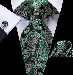 Looking for an accessory that effortlessly combines sophistication and style? Feast your eyes on our Men's Silk Necktie Pocket Square Cufflink Set in captivating green! It guarantees a non-deformed, soft, and authentically polished appearance since it is made from opulent silk utilizing the Jacquard weaving technique. This set includes a tie that measures 59 by 3.15 inches which will help you embrace your inner spiffy, a pocket square that is 9 by 9 inches, and cufflinks that have a stylish 0.55-inch circle. Make a statement with your attire for formal gatherings, such as proms, weddings, and banquets. The elaborate designs make you the center of attention at any gathering and go beautifully with suits and tuxedos. This Necktie Pocket Square Cufflink Set will add flair to your closet and w Tie Matching, Men Tie, Floral Necktie, Luxury Ties, Necktie Set, Mens Silk Ties, Paisley Tie, Green Paisley, Tie Men's