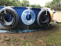 an inflatable pool with two tires attached to it