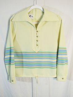 "Dig that collar! It's a 1970s Vintage Herman Marcus HM III Women's Knit Top pullover! Tunic style? Measured Size 18\" P2P, Yellow w/ Green / Tan / Blue Horizontal Stripes and it's a vertical stripe WEAVE as well. Very cool. Hem tie like a tunic. Shiny brassy buttons.  Not sure what to call this with the zipper up the back. Not a sweater, not sure. It's unique! And, it looks to me like it was never worn. It's gorgeous. Smoke free. Measurements: Label size: 8 (vintage sizing!) Shoulder-to-shoulde Womens Knit Tops, Tunic Style, Horizontal Stripes, Tunic Styles, Vintage Textiles, Vintage Wool, Womens Clothing Tops, Clothing Items, Knit Top