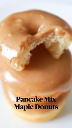 a close up of a doughnut with a bite taken out of it and the text baked pancake mix with maple glaze