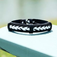 🖤 Introducing Our Striking Black Leather Adjustable Bracelet with Woven White Nylon Accents 🤍 Elevate your accessory game with our latest offering - a masterpiece that merges the timeless allure of black leather with the contemporary charm of intricate white nylon weaving. This adjustable bracelet is not just an accessory; it's an embodiment of contrast and artistry. 🌟 Key Features: ✨Black leather for an effortlessly stylish look ✨ Handwoven white nylon strands that create a mesmerizing patte Casual Black Braided Bracelets For Outdoor, Adjustable Black Wristband For Father's Day, Adjustable Black Braided Bracelet For Outdoor, Gift Boyfriend, Hippie Bracelets, Black Leather Bracelet, Heavy Chain, Free Bracelet, Men's Bracelet