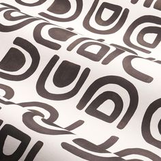 an abstract black and white pattern with the word buddha written in cursive writing