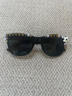 Soccer Mom sunglasses!  Tell me your team mascot and your colors and lets have your team spirit sparkle  I can make them with any wording requested or sunglass style wanted.  Purchasing in bulk can lead to a discounted price. Mom Sunglasses, Team Mascots, Soccer Mom, Oct 11, Team Spirit, Eyewear Sunglasses, Fashion Sunglasses, Tell Me, Sunglasses Accessories