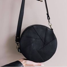 Introducing our stunning Circle Leather Bag, the perfect accessory to elevate your style. Crafted from high-quality leather, this round purse combines timeless elegance with modern sophistication. Wear it as a crossbody bag for a hands-free convenience or adjust the strap to carry it as a shoulder bag. The circular design adds a unique touch to any outfit, making it an essential piece in every fashion-forward woman's wardrobe. Embrace the beauty of simplicity with our Women's Round Crossbody Bag, designed to make a statement wherever you go. ⭐ Size: - diameter of a circle is 22 cm - side width 8cm ⭐ Material: genuine leather You can choose the color of the leather! PERSONALIZATION We can do initials, text or name on any item (maximum 5 letters) To make your item personalized 1. Choose "Col Diameter Of A Circle, Unique Crossbody Bag, Round Crossbody Bag, Circle Purse, Small Leather Purse, Round Purse, Stylish Purse, Women Crossbody Bag, Circular Design