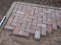 bricks laid out on the ground to make a walkway