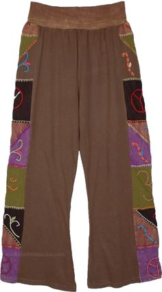 Bring out an inner boho retro look with these fabulous pants, the cotton pants have a unique set of embroidered florals running on the sides- in green, purple, brown etc, which makes them a one-of-a-kind piece. These cotton pants feature a flexible and comfortable yoga waist. #tlb #SplitSkirtsPants #Patchwork #Embroidered #bohemianfashion #Handmade #BohemianPants #FallPants #PatchworkPants #HippieCottonPants Hippie Style Cotton Pants For Fall, Festival Brown Patchwork Bottoms, Brown Cotton Harem Pants For Fall, Multicolor Cotton Harem Pants For Fall, Cotton Harem Pants For Fall Festival, Hippie Style Brown Bottoms For Festival, Brown Hippie Bottoms For Festival, Hippie Style Brown Festival Bottoms, Brown Patchwork Long Pants