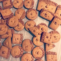 some very cute looking cookies with faces on them