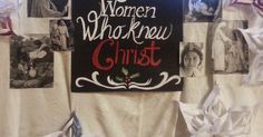 there is a sign that says women who knew christ hanging on the wall in front of it