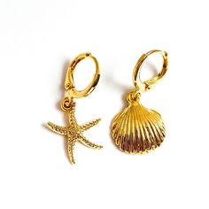 "Stunning mismatched gold beach earrings featuring a starfish and shell charm! ✨Details✨ * 18ct gold plated * Latch back fastening for security * Approximate drop is 1.75\" (45mm) * Huggie hoop measures 0.5\" (12mm) in diameter * Lightweight and easy to wear  * Beautifully packaged with additional gift wrap available at the checkout * Add a gift message and ship direct to the recipient  ✨ Related Items✨ Also available as a pair of starfish or a pair of shells - please select your desired combina Gold Ocean-inspired Beach Earrings, Gold Star Earrings For Summer, Gold Starfish Earrings Nickel Free, Nickel Free Gold Ocean-inspired Earrings, Nickel-free Gold Starfish Earrings, Gold Nickel-free Starfish Earrings, Nickel Free Ocean-inspired Gold Earrings, Yellow Gold Beach Earrings, Yellow Gold Pierced Earrings For Beach