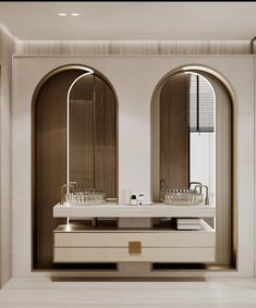 a bathroom with two sinks and mirrors in front of the wall, along with an arched window