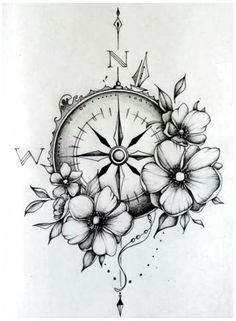 a compass with flowers on it and arrows coming out of the top right hand corner