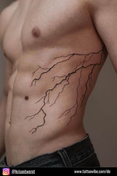 a man's stomach with a lightning tattoo on his chest and the upper part of his body