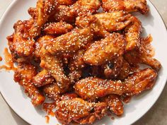 chicken wings with sesame seeds on a white plate