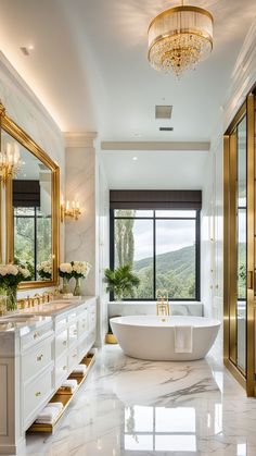 a large bathroom with marble flooring and gold trim around the bathtub, chandelier