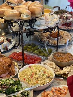 a buffet table filled with lots of food