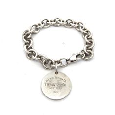 * Tiffany Co 925 Sterling Silver Return To Tiffany Round Tag Charm Bracelet * Length: 7-5/8" * Width: 7/16" * Disc Charm Length: 1-1/4" Including The Bale * Disc Charm Width: 1" * Bracelet Weight: 36.9 G * Marked: Please Return To Tiffany Co. * Tiffany Co. * New York * 925 * Clasp: Lobster * Retail Price: Approximately $595 * Condition: As Pictured. * Charm Can Be Engraved For An Additional Price. * S6354 Return To Tiffany, Round Tags, Tiffany & Co., Womens Jewelry Bracelets, Charm Bracelet, 925 Sterling Silver, Women Jewelry, New York, Tags