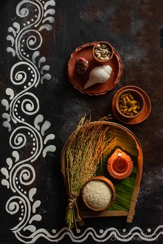 an overhead view of some food on a plate with rice and other foods in bowls