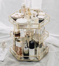 Enhance your cosmetic organization with this elegant and modern makeup organizer featuring a 360-degree rotation for effortless access to all your beauty products. Constructed from premium glass, this durable and sturdy organizer boasts multiple compartments designed to neatly store various cosmetics and perfumes. Its sophisticated design adds a refined touch to your bathroom vanity or dresser, while its functionality ensures your makeup and fragrance collection is organized and always within ar Makeup Organizer Countertop, Rangement Makeup, Makeup Tray, Perfume Organization, Acrylic Organizer Makeup, Neutral Pillows, Perfume Tray, Make Up Organiser, Skincare Organization