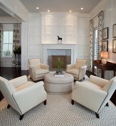 a living room filled with furniture and a fire place